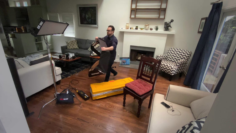 Michael Cioni sets up lights for the Workflow From Home set.