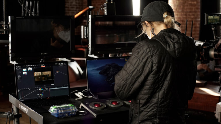A digital imaging technician working on a film set.