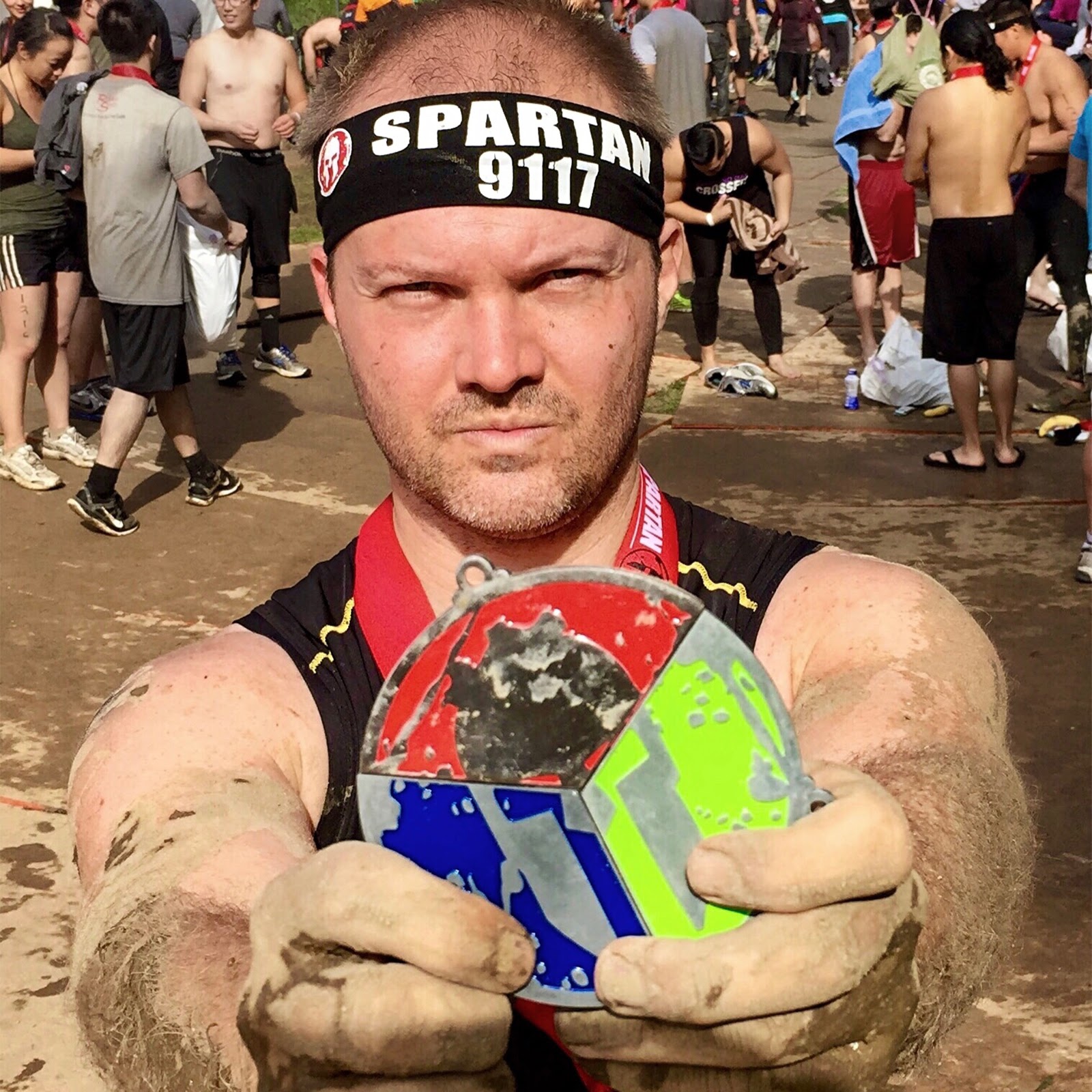 Zack Arnold with Spartan Trifecta medal