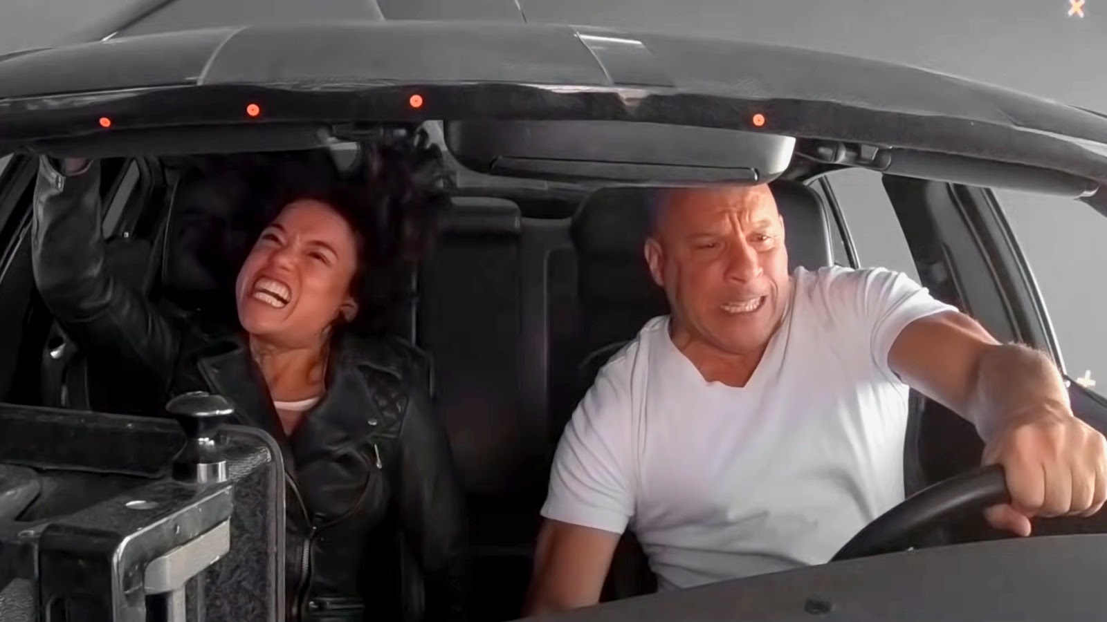 Michelle Rodriguez and Vin Diesel inside the rolling car rig