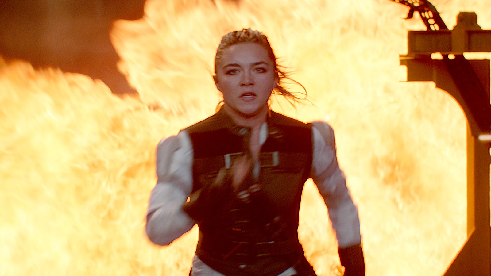 Yelena runs from an explosion in Black Widow