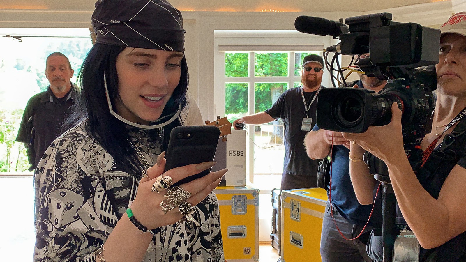 Billie Eilish checks her phone while DP Jenna Rosher films with a Canon C300 Mk II