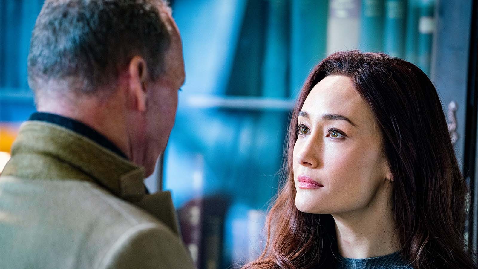 Rembrandt (Michael Keaton) and Anna (Maggie Q) develop a connection in The Protégé.