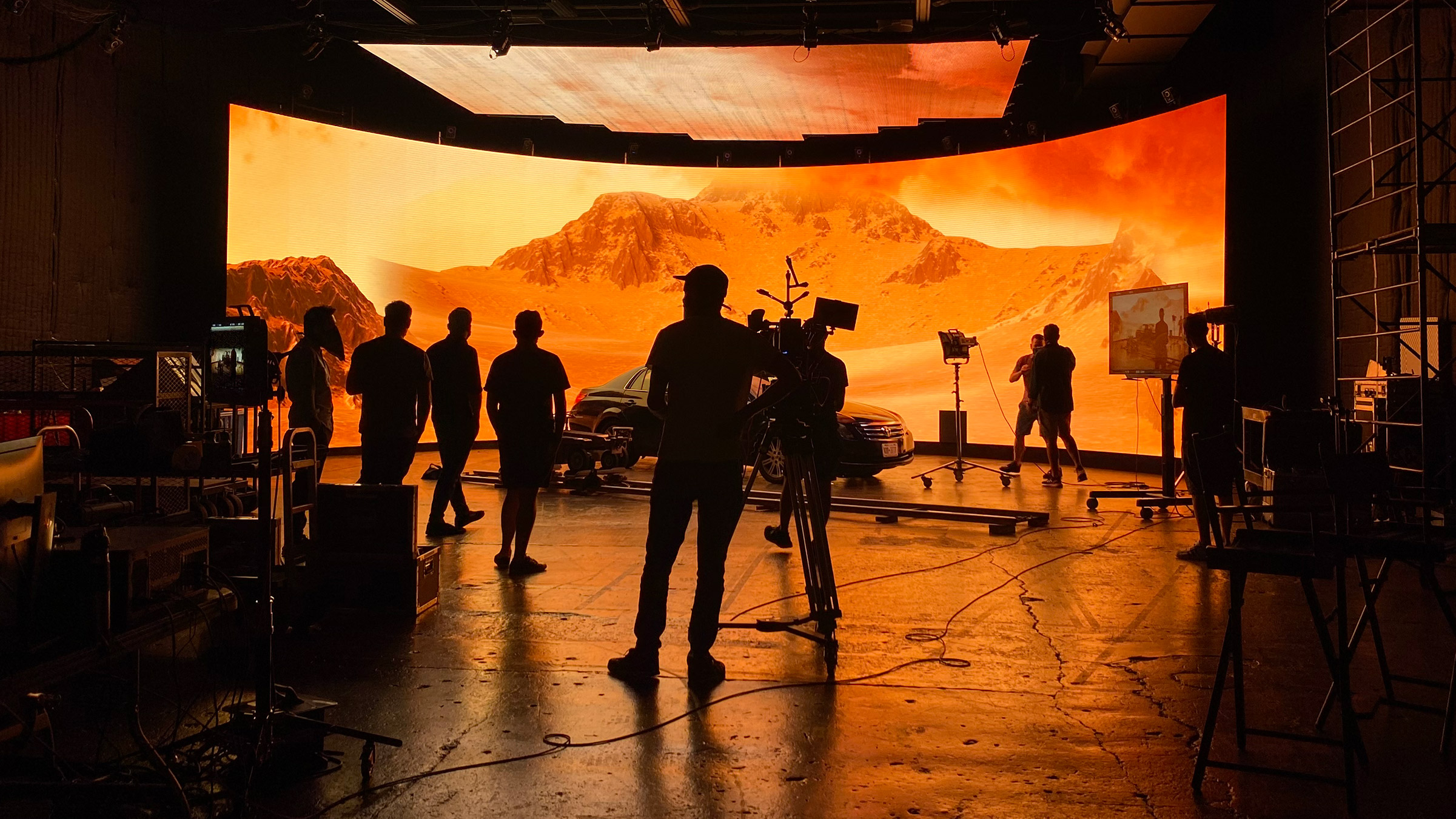 A film crew shooting a scene on a virtual LED stage