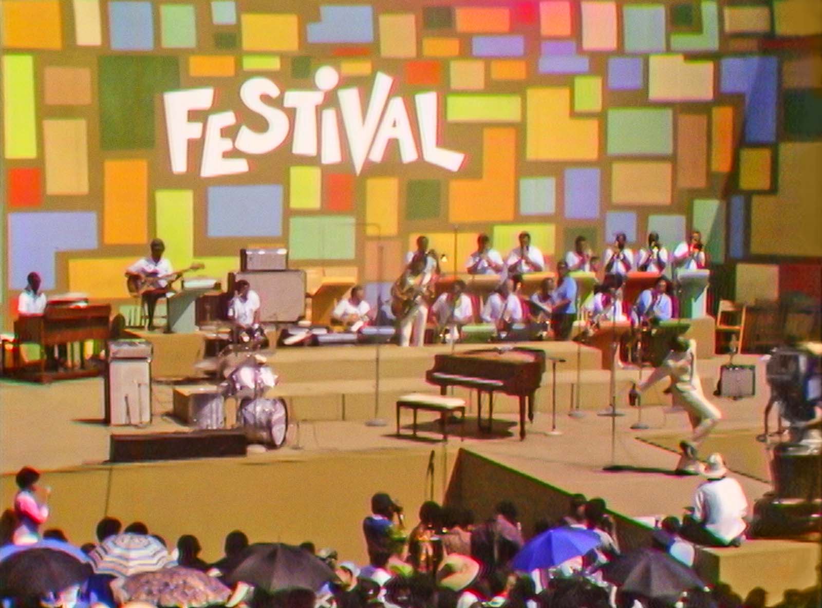 Tony Lawrence hosting the Harlem Cultural Festival in 1969, as featured in Summer of Soul. Image © 20th Century Studios