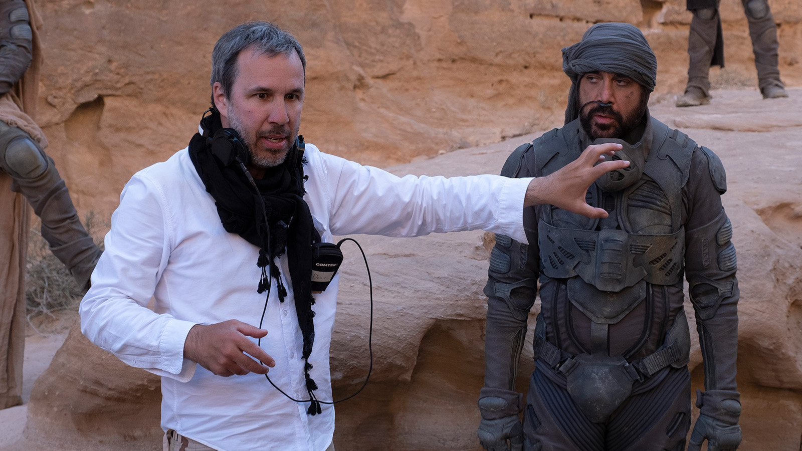 Dune director Denis Villeneuve with Javier Bardem on location in Jordan. Image © Warner Bros.