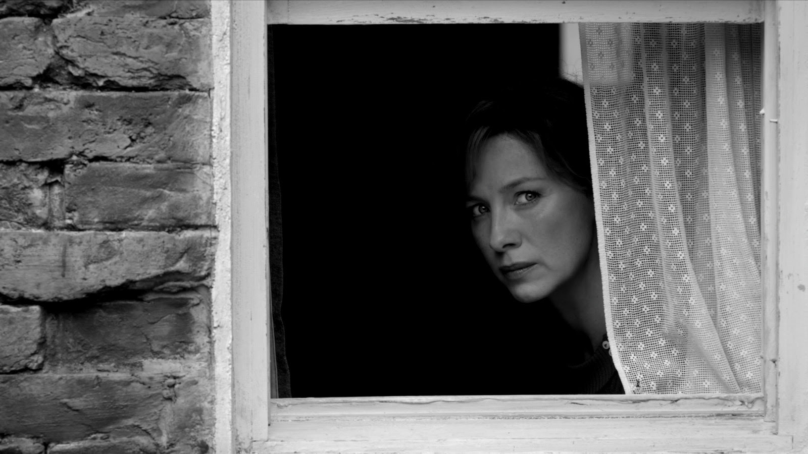 Ma (Catríona Balfe) checks the street in Belfast. Image © Focus Features