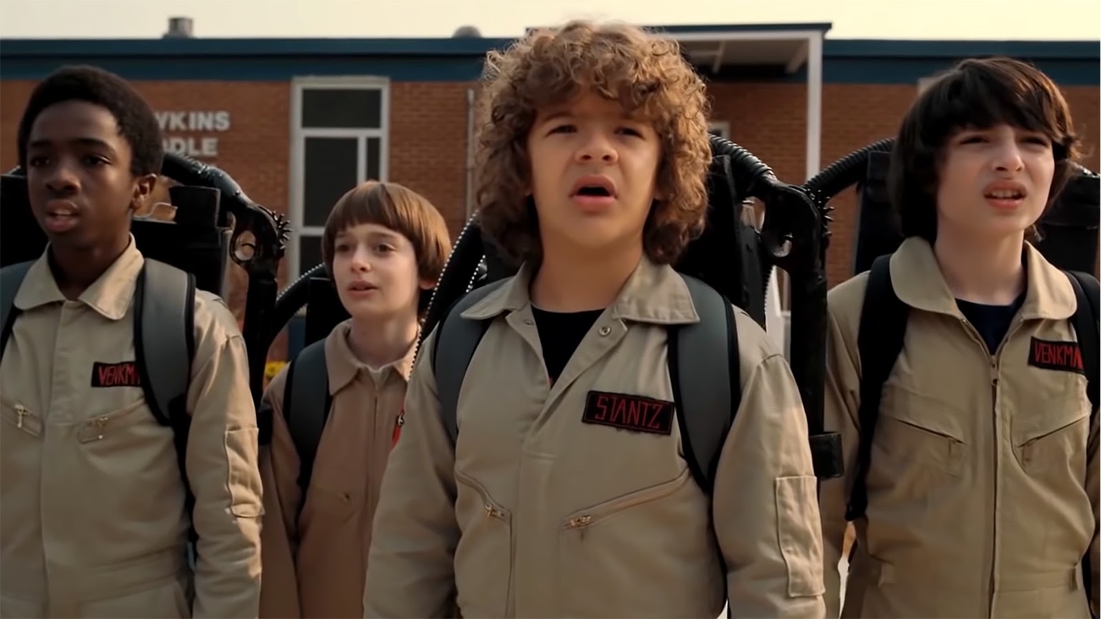 And dressed as a Ghostbuster (right) in Stranger Things. 