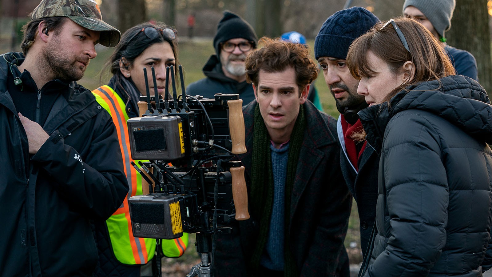 Lin Manuel Miranda, Alice Brooks (right), and Andrew Garfield crowd the monitor during filming for tick, tick...Boom!. Image © Warner Bros