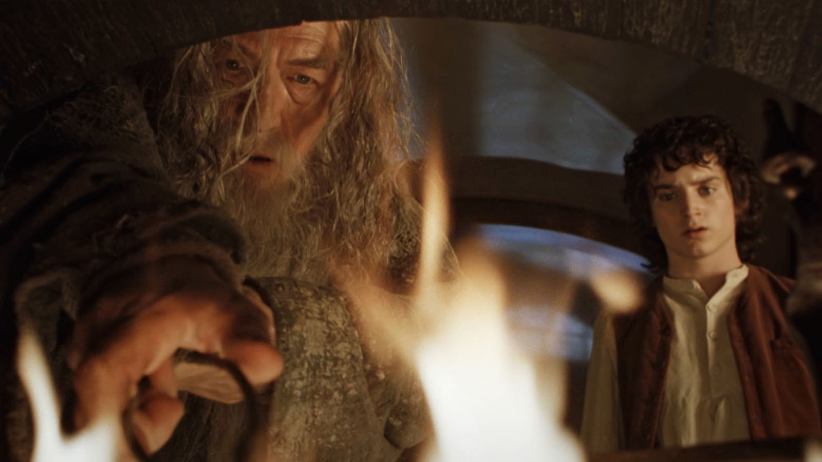 Gandalf fetches the One Ring from the fireplace