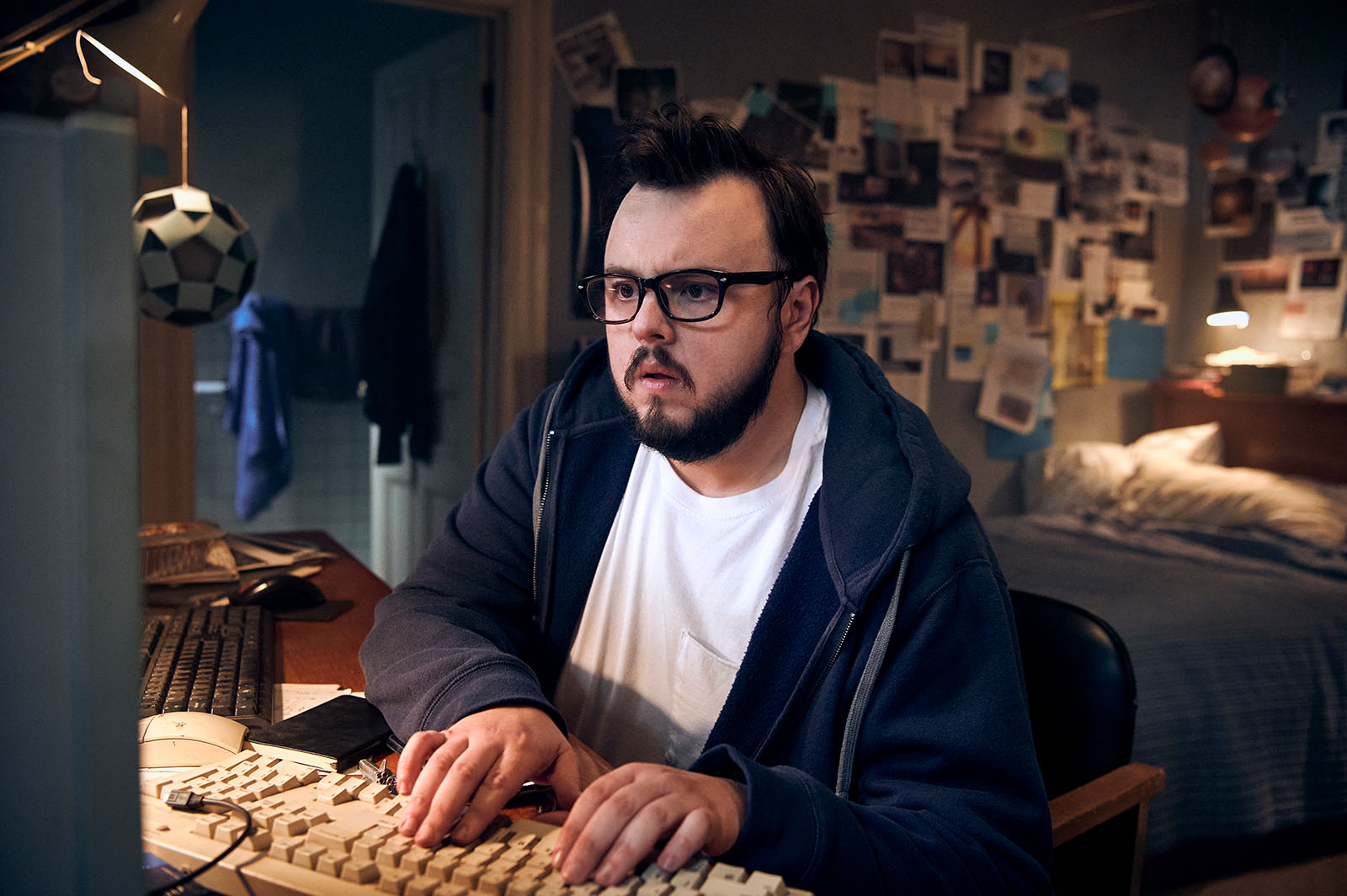 John Bradley’s character, KC Houseman, uncovers a secret. Image © Lionsgate Movies