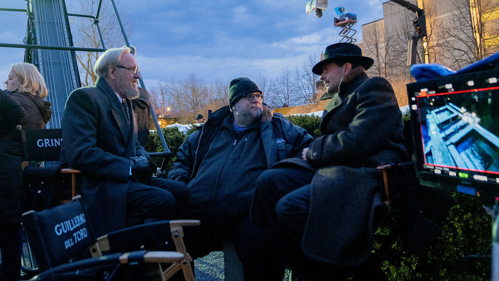 Richard Jenkins and Bradley Cooper sit with director Guillermo del Toro—who presumably has stolen someone’s chair. Image © Searchlight Pictures
