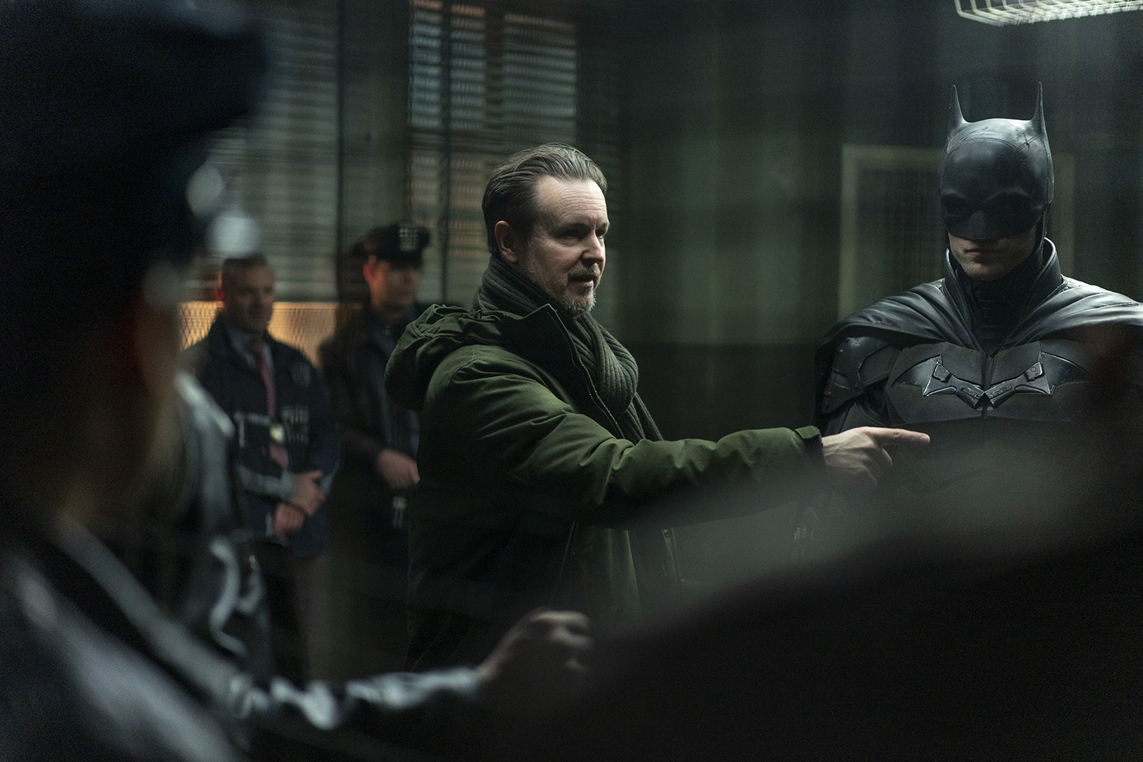 Director Matt Reeves directs on the police station set. Image © Warner Bros.
