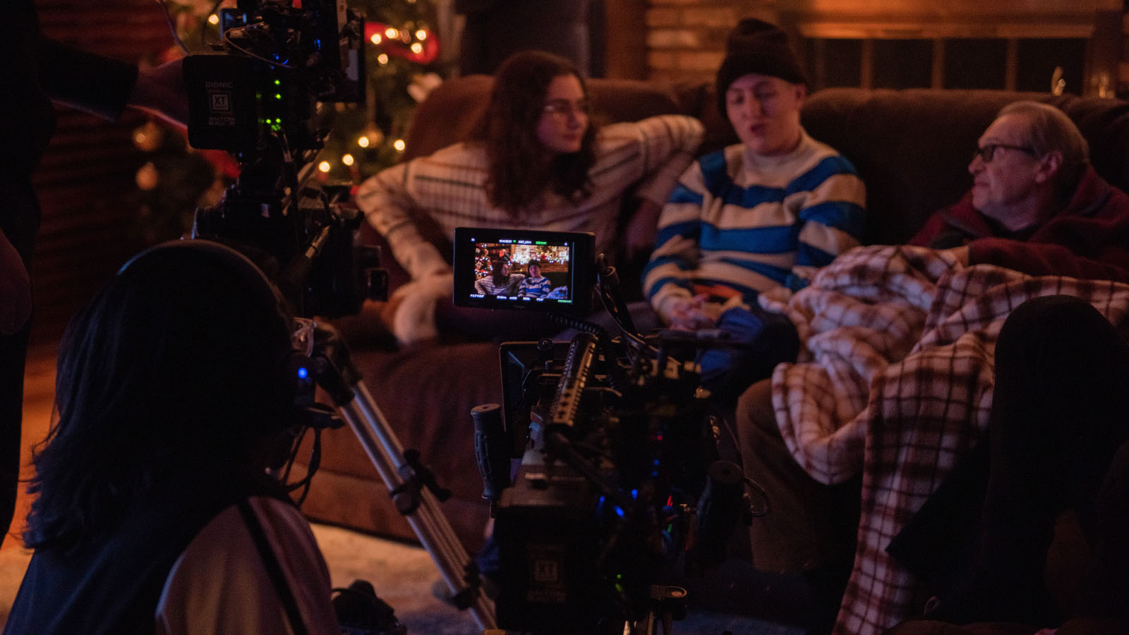Christmas couch scene with Emily Robertson (L), Alex Heller (M), and Steve Buscemi (R).