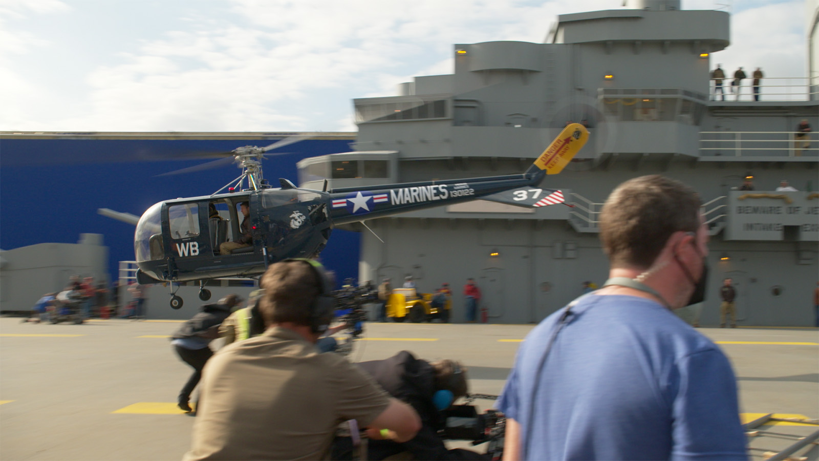 On location in Georgia with a replica of the USS Leyte’s bridge in the background and a Sikorsky HO5S taking off in the foreground. Image © Sony Pictures Entertainment