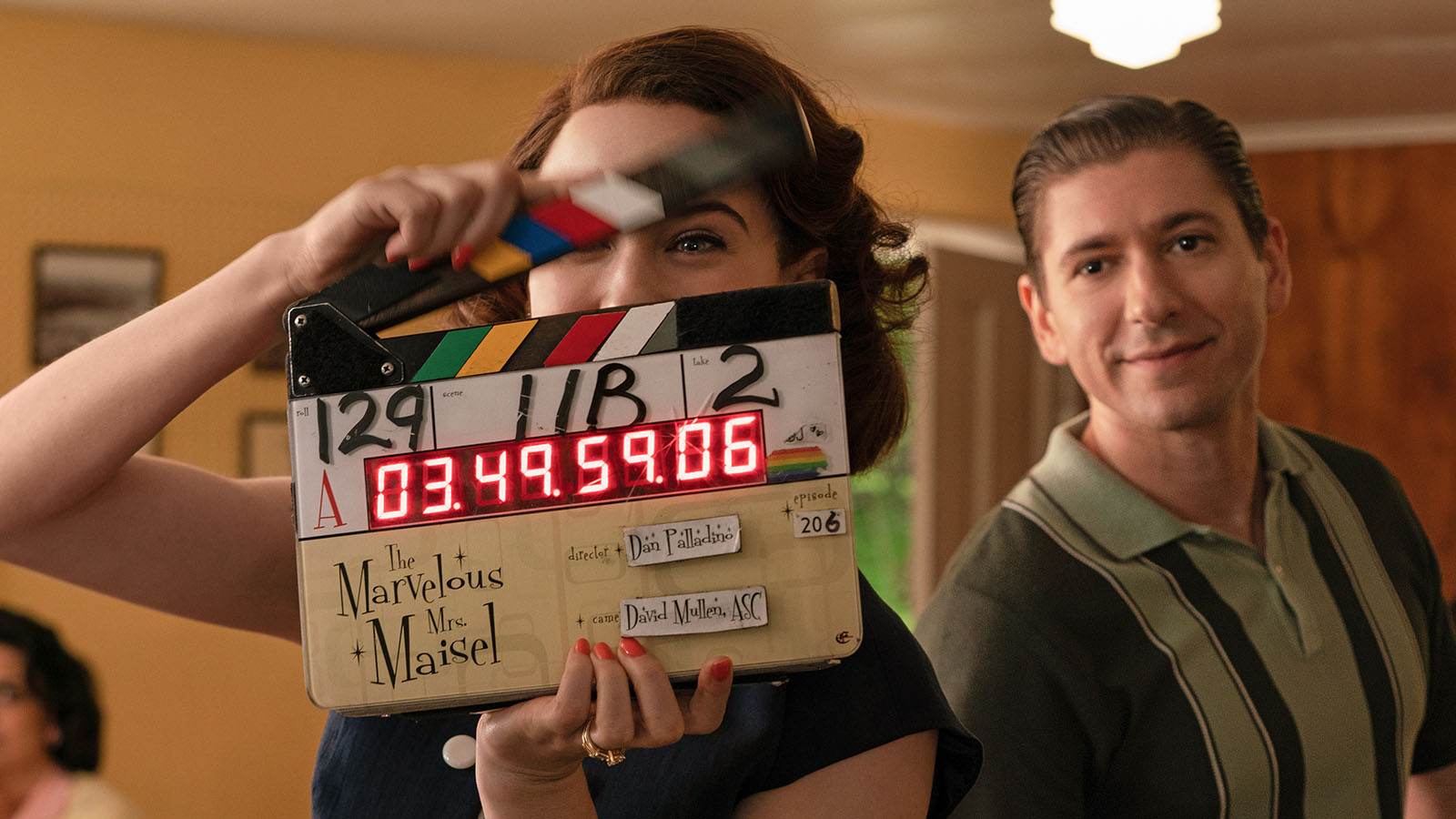 Rachel Brosnahan and Michael Zegan (Midge and Joel Maisel) with the slate for episode 206 of The Marvelous Mrs. Maisel. Image © Amazon Studios