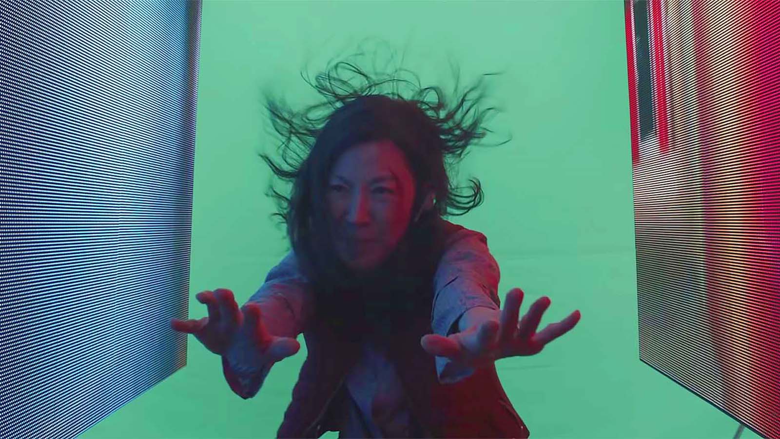 Michelle Yeoh is lit by low-budget LED screens with chromakeyed backplate used for the zooming transition effects. Image © A24