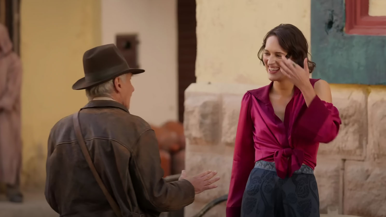 Harrison Ford and Phoebe Waller-Bridge share a moment on location for Dial of Destiny.
