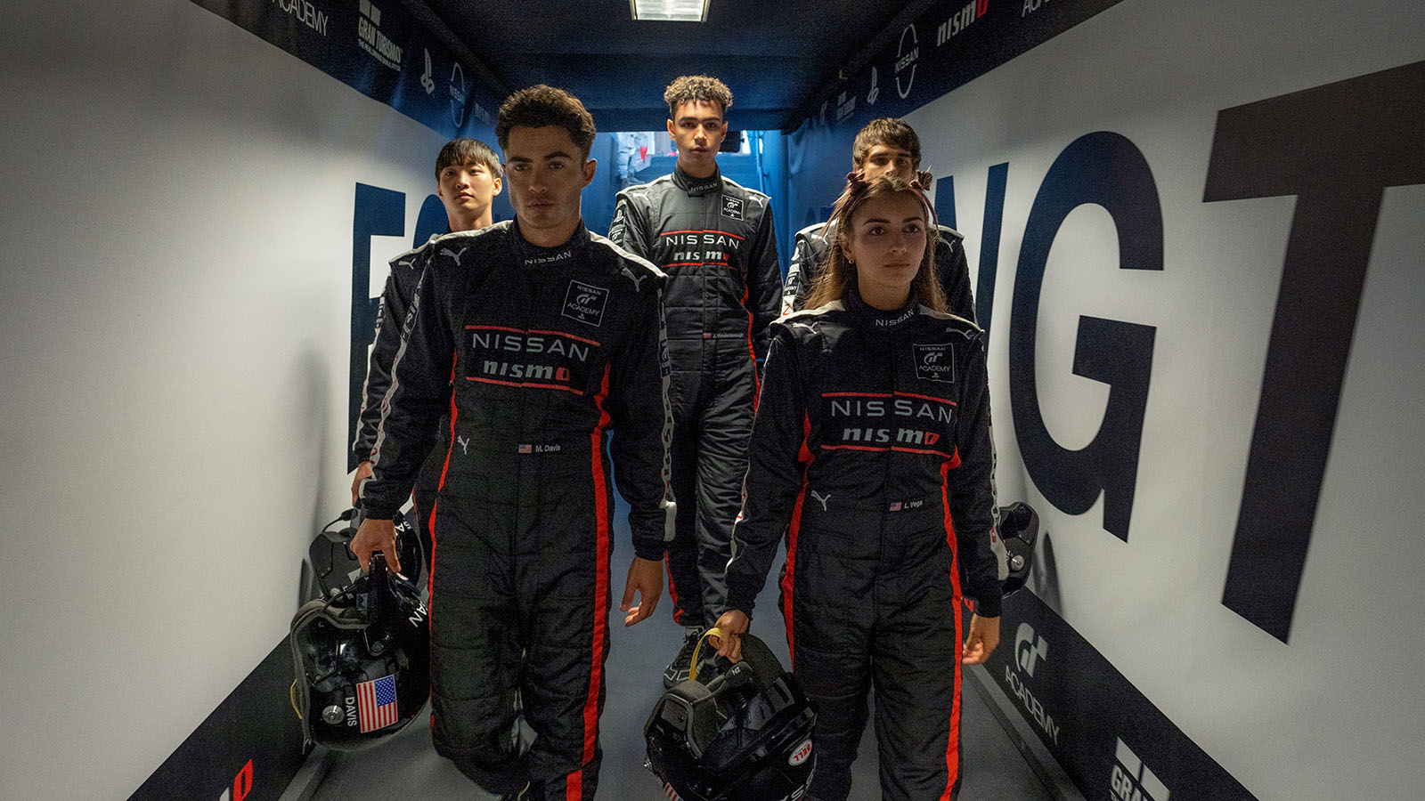 Heading out to the paddock. Gamers become drivers in Gran Turismo. Image © Sony Pictures