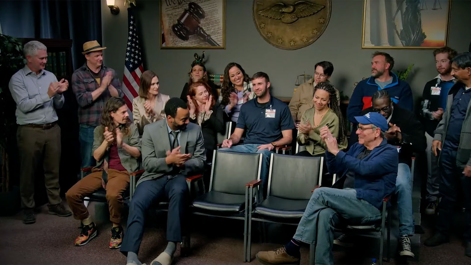 Ron Gladden gets a well-earned round of applause from the Jury Duty cast. Image © Amazon Prime Video