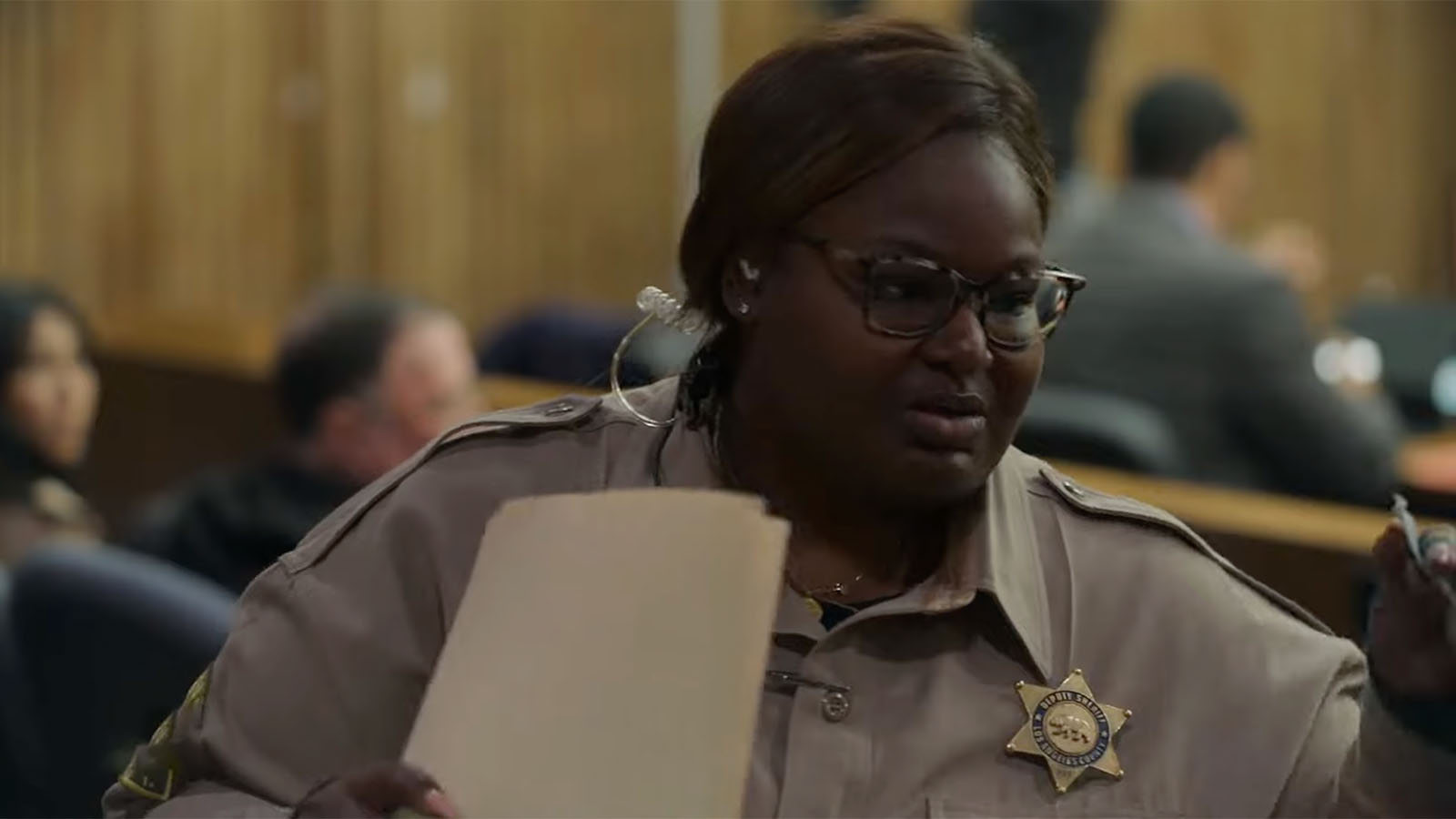 Jury Duty's court officer Nikki Wilder (Rashida Olayiwola) helps to move things in the right direction. Image © Amazon Prime Video