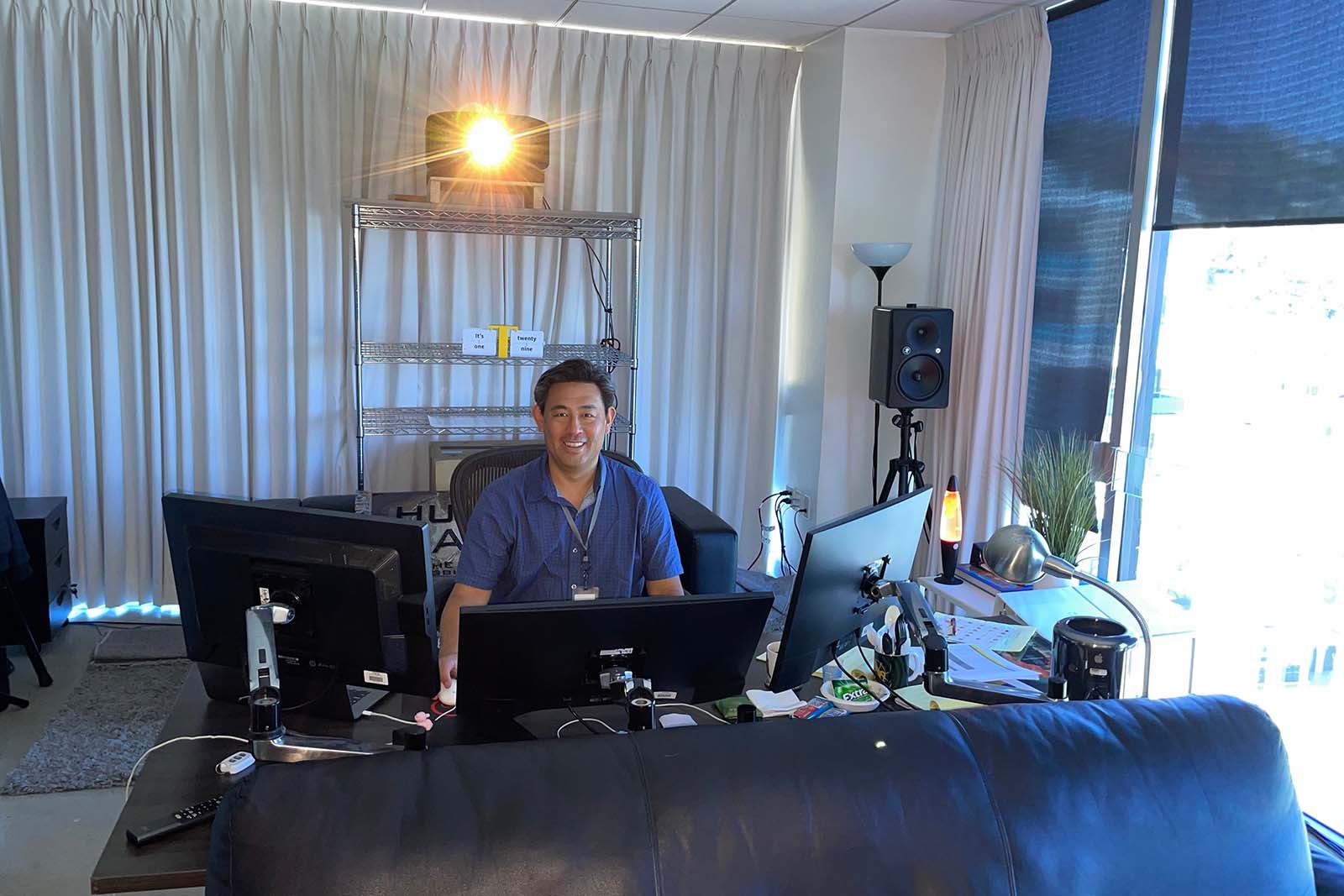 Editor Yoshikawa at his desk, with his trusty overhead projector.