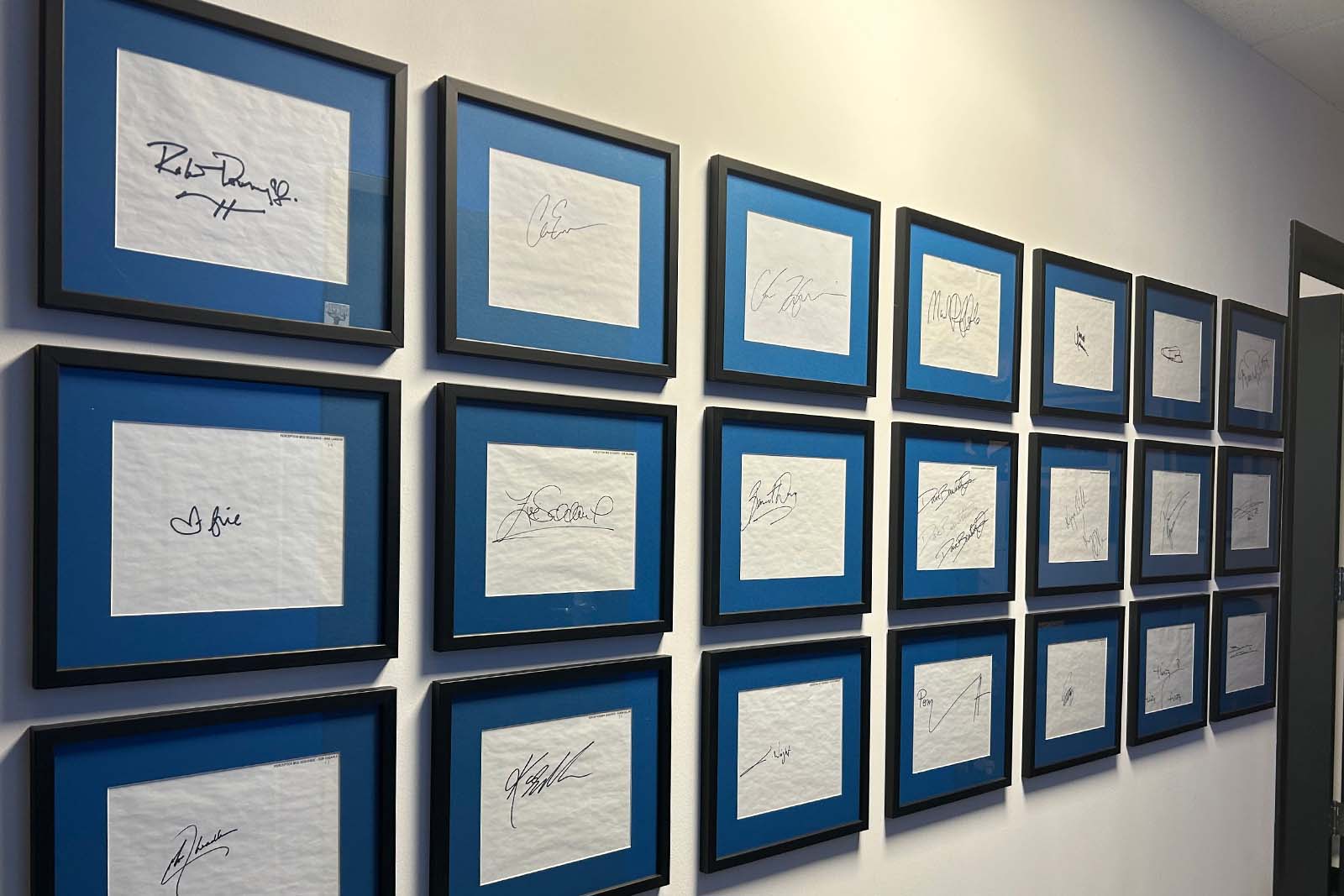 A peek at the Perception office’s prized autograph wall.