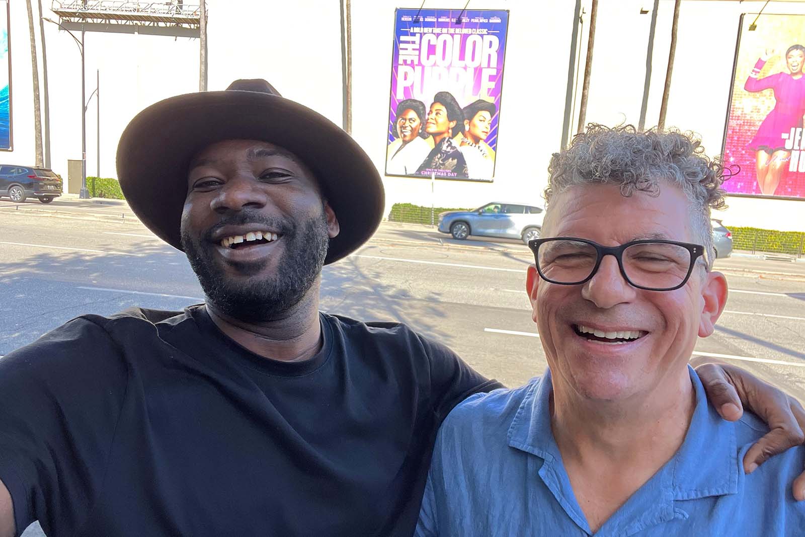 Director Bazawule and editor Jon Poll find a Color Purple movie poster in the wild.