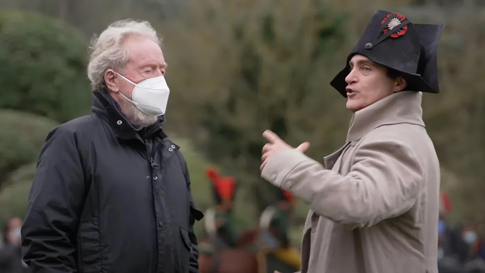Director Ridley Scott on set with Joaquin Phoenix. Image © Apple