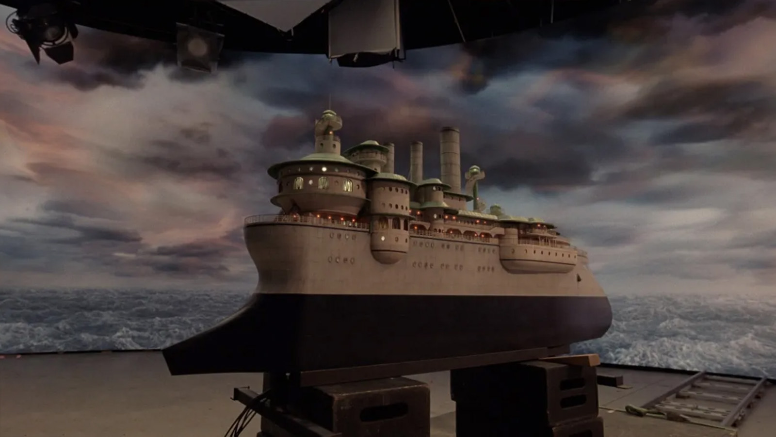 Before and after the VFX work on the miniature ship model in Poor Things. Images © Searchlight Pictures