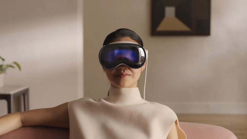 Woman using the Apple Vision Pro at home.