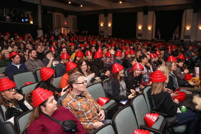 The entire audience was given “energy domes” for the premier of the film Devo. Image © Michael Hurcomb / Shutterstock for Sundance Film Festival