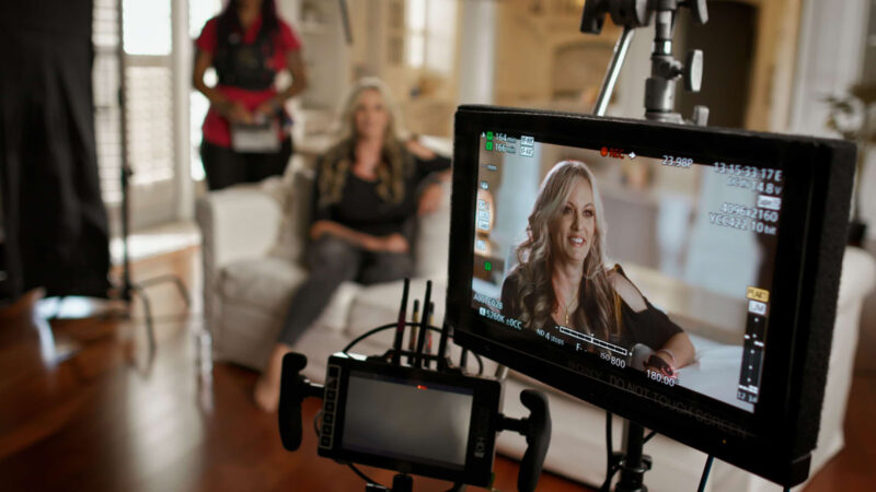 Stormy Daniels recording an interview behind the scenes of Stormy. Image © Peacock