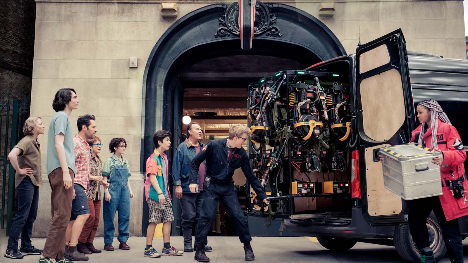 The Ghostbusters get some help from Dr. Lars Pinfield, a nerdy paranormal researcher. Image © Sony Pictures Entertainment