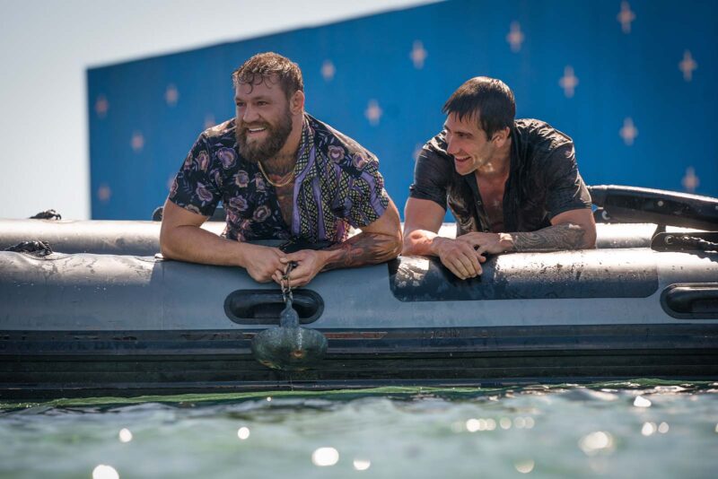 Jake Gyllenhaal and Conor McGregor stay cool between takes on the set of Road House. Image © Amazon