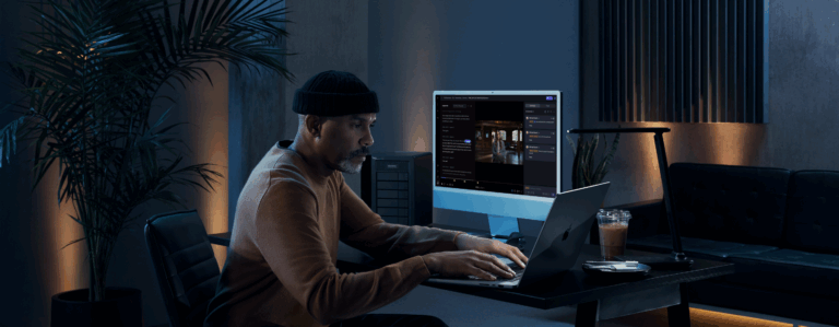 man at his desk with frame.io transcription in desktop
